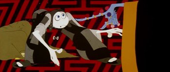 Movie still from “The Thief and the Cobbler” (1993), directed by Richard Williams – An animated monkey is sitting on the ground; Medium shot, High angle