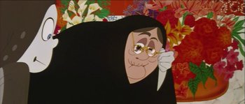 Movie still from “The Thief and the Cobbler” (1993), directed by Richard Williams – An old woman with glasses is holding a knife in her hand; Close Up shot, Low angle