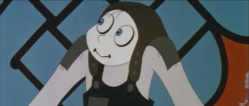 Movie still from “The Thief and the Cobbler” (1993), directed by Richard Williams – A cartoon of a woman with glasses and a black shirt; Close Up shot, Low angle