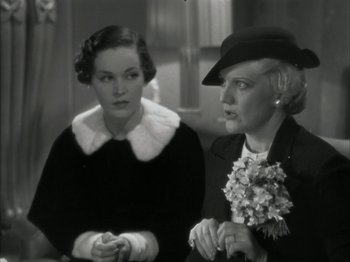 Movie still from “The Thin Man” (1934), directed by W.S. Van Dyke – Two women are sitting next to each other; Close Up shot, Over the shoulder angle