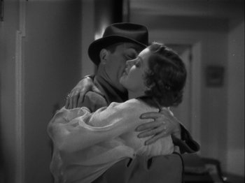 Movie still from “The Thin Man” (1934), directed by W.S. Van Dyke – A man and a woman kissing in a room; Medium shot, Low angle