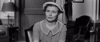 Movie still from “The Three Faces of Eve” (1957), directed by Nunnally Johnson – A black and white photo of a woman wearing a hat; Close Up shot, High angle