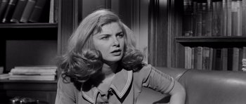 Movie still from “The Three Faces of Eve” (1957), directed by Nunnally Johnson – A black and white photo of a woman with long blonde hair; Close Up shot, Over the shoulder angle