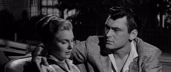 Movie still from “The Three Faces of Eve” (1957), directed by Nunnally Johnson – A man and a woman sitting next to each other; Close Up shot, Low angle