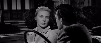 Movie still from “The Three Faces of Eve” (1957), directed by Nunnally Johnson – A man and a woman talking to each other; Close Up shot, Over the shoulder angle