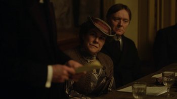 Movie still from “Anne with an E” (2017), created by Moira Walley-Beckett – A woman wearing a hat sitting next to a man; Medium shot, Over the shoulder angle