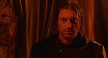 Movie still from “The Ugly Swans” (2006), directed by Konstantin Lopushanskiy – A person with long hair; Close Up shot, Over the shoulder angle