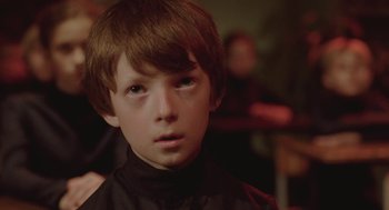 Movie still from “The Ugly Swans” (2006), directed by Konstantin Lopushanskiy – A young boy is looking into the distance; Close Up shot, Over the shoulder angle