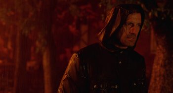 Movie still from “The Ugly Swans” (2006), directed by Konstantin Lopushanskiy – A man wearing a leather jacket and a hood; Close Up shot, Over the shoulder angle