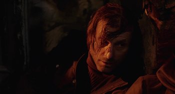 Movie still from “The Ugly Swans” (2006), directed by Konstantin Lopushanskiy – A person wearing a jacket; Close Up shot, High angle