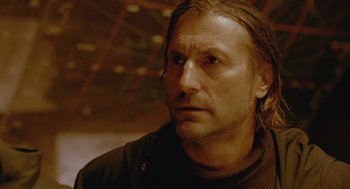 Movie still from “The Ugly Swans” (2006), directed by Konstantin Lopushanskiy – A person with long hair; Close Up shot, Low angle