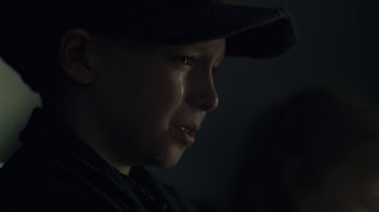 Movie still from “Anne with an E” (2017), created by Moira Walley-Beckett – A young boy with a hat and a tear in his eye; Close Up shot, Low angle