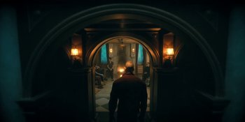 Movie still from “The Umbrella Academy” (2019), created by Steve Blackman – A man standing in front of a door way; Wide shot, Low angle