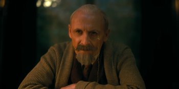 Movie still from “The Umbrella Academy” (2019), created by Steve Blackman – An old man with a beard and a mustache; Close Up shot, Low angle