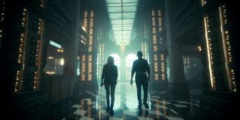 Movie still from “The Umbrella Academy” (2019), created by Steve Blackman – A man and a woman are walking in a hallway; Wide shot, Low angle
