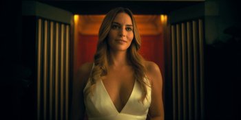Movie still from “The Umbrella Academy” (2019), created by Steve Blackman – A woman in a white dress standing in front of an elevator; Close Up shot, Low angle