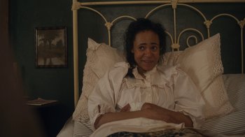 Movie still from “Anne with an E” (2017), created by Moira Walley-Beckett – A woman in a white dress is laying in bed; Medium shot, High angle