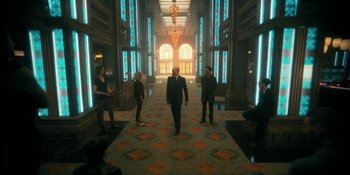 Movie still from “The Umbrella Academy” (2019), created by Steve Blackman – A group of people standing in a room; Wide shot, Low angle