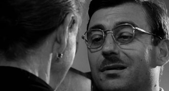 Movie still from “The Visit” (1964), directed by Bernhard Wicki – A man and a woman face to face in a black and white photo; Close Up shot, Over the shoulder angle