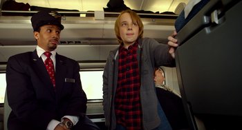 Movie still from “The Visit” (2015), directed by M. Night Shyamalan – A young boy is standing on a train; Medium shot, Over the shoulder angle