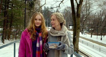 Movie still from “The Visit” (2015), directed by M. Night Shyamalan – A woman and a young girl standing next to each other; Medium shot, Over the shoulder angle