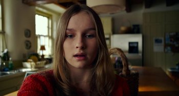 Movie still from “The Visit” (2015), directed by M. Night Shyamalan – A young girl with long blonde hair looking at the camera; Close Up shot, Low angle