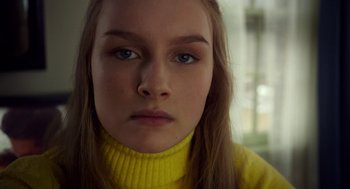 Movie still from “The Visit” (2015), directed by M. Night Shyamalan – A person wearing a yellow sweater; Close Up shot, Low angle
