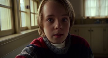 Movie still from “The Visit” (2015), directed by M. Night Shyamalan – A person wearing a sweater; Close Up shot, Low angle