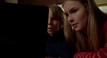 Movie still from “The Visit” (2015), directed by M. Night Shyamalan – Two young people are looking at a computer screen; Close Up shot, Low angle