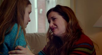 Movie still from “The Visit” (2015), directed by M. Night Shyamalan – A woman and a girl sitting on a couch looking at each other; Close Up shot, Over the shoulder angle