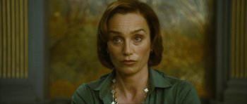 Movie still from “The Walker” (2007), directed by Paul Schrader – A person wearing a green shirt; Close Up shot, Low angle