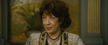 Movie still from “The Walker” (2007), directed by Paul Schrader – An older woman wearing a necklace and a dress; Close Up shot, High angle