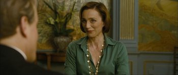 Movie still from “The Walker” (2007), directed by Paul Schrader – A person wearing a green shirt; Close Up shot, Over the shoulder angle