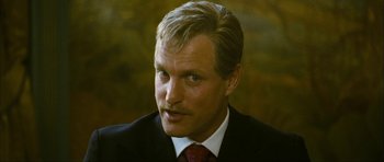 Movie still from “The Walker” (2007), directed by Paul Schrader – A person wearing a suit and tie; Close Up shot, Low angle