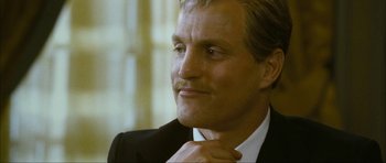 Movie still from “The Walker” (2007), directed by Paul Schrader – A person wearing a suit and tie; Close Up shot, Low angle