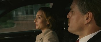 Movie still from “The Walker” (2007), directed by Paul Schrader – A man and a woman sitting in the back of a car; Close Up shot, Over the shoulder angle