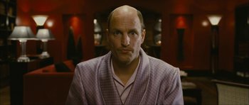 Movie still from “The Walker” (2007), directed by Paul Schrader – A man with a bald head wearing a robe; Close Up shot, Over the shoulder angle