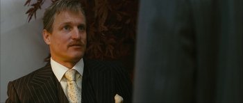 Movie still from “The Walker” (2007), directed by Paul Schrader – A man wearing a suit and tie sitting in a room; Close Up shot, Low angle