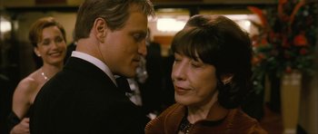 Movie still from “The Walker” (2007), directed by Paul Schrader – A man and a woman looking at one another; Close Up shot, Over the shoulder angle