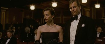 Movie still from “The Walker” (2007), directed by Paul Schrader – A man and a woman in a black dress; Medium shot, Low angle