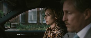 Movie still from “The Walker” (2007), directed by Paul Schrader – A woman sitting in the back seat of a car looking out the window; Close Up shot, Over the shoulder angle