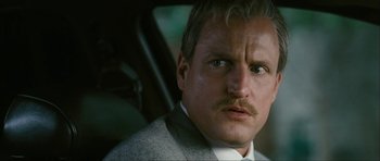 Movie still from “The Walker” (2007), directed by Paul Schrader – A person wearing a suit and tie; Close Up shot, Low angle