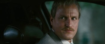 Movie still from “The Walker” (2007), directed by Paul Schrader – A person wearing a suit and tie; Close Up shot, Low angle