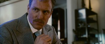 Movie still from “The Walker” (2007), directed by Paul Schrader – A person wearing a suit and tie; Close Up shot, Low angle