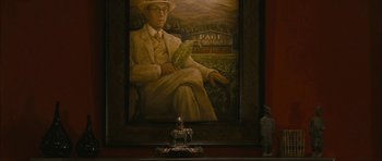 Movie still from “The Walker” (2007), directed by Paul Schrader – A painting of an old man sitting in front of a painting; Medium shot, Over the shoulder angle