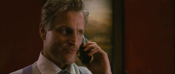 Movie still from “The Walker” (2007), directed by Paul Schrader – A person talking on a cell phone; Close Up shot, Low angle