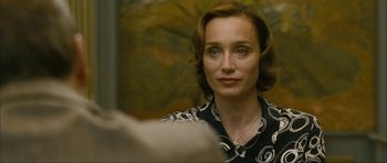 Movie still from “The Walker” (2007), directed by Paul Schrader – A person wearing a black and white shirt; Close Up shot, Over the shoulder angle