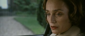 Movie still from “The Walker” (2007), directed by Paul Schrader – A person sitting in a car; Close Up shot, Over the shoulder angle