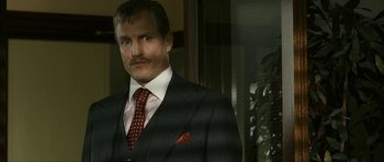 Movie still from “The Walker” (2007), directed by Paul Schrader – A person wearing a suit and tie; Close Up shot, Low angle