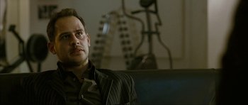 Movie still from “The Walker” (2007), directed by Paul Schrader – A person sitting in a room; Close Up shot, Over the shoulder angle